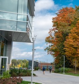 Adirondack Hall is surrounded by the bright colors of fall foliage