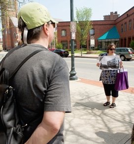 A Continuing Education group listens to a tour guide