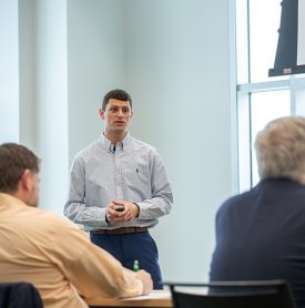 A student presents in a business class