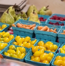 Fresh produce lines a table at a Farm Market in the Student Center