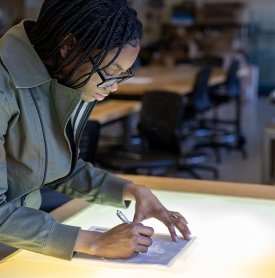 A student works on a 2D design in art class