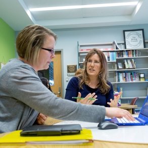 English professor Stephanie Drotos works with a student in the Reading and Writing Center