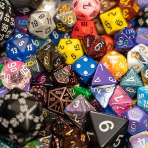 A bucket of dice is seen