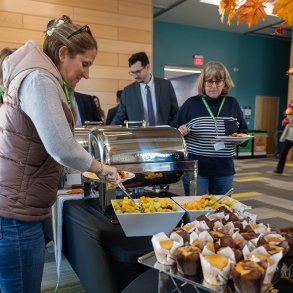 Event attendees in line for catered food 