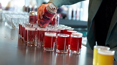 Image of Common Roots beverage being poured at a Collaborative Cuisine dinner