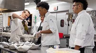 Chef Matt Bolton and students using Lake George Olive Oil