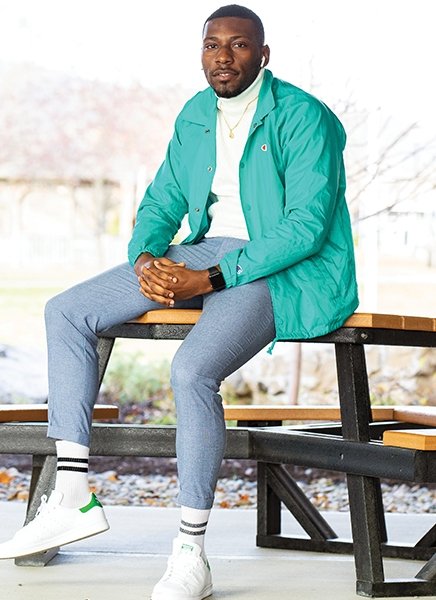 Portrait of Jac'quan Thompson in front of the student center