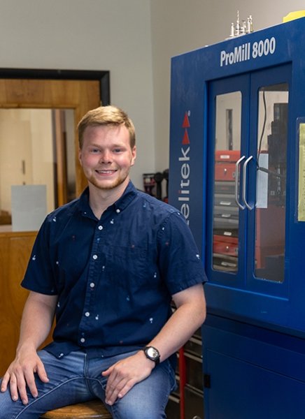 SUNY Adirondack alum Shawn Norton is seen in the Mechatronics lab