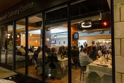 A special event at Seasoned Restaurant is seen from outside the restaurant