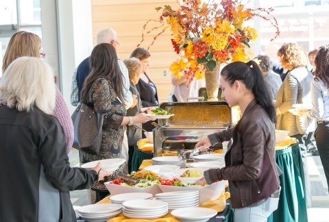 Image of people in line for food at a catered event in Northwest Bay Conference Center