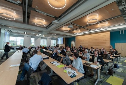 Professional workshop event with a large audience in Northwest Bay Conference center