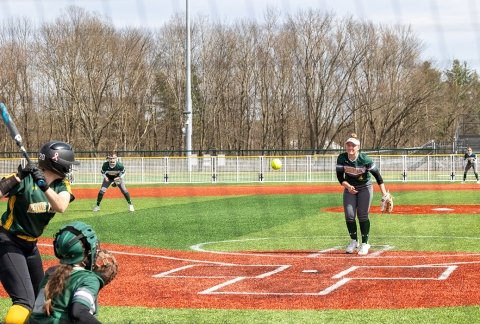 Women's softball during a game on the turf field